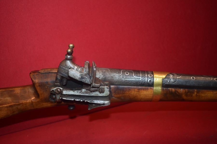 ISLAMIC ARABIC FLINTLOCK RIFLE WITH ORNATE DAMASCUS BARREL